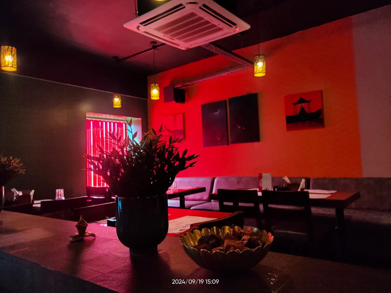 Minyu The Asian Affair interior — warm Indo-Chinese ambience with wood and soft light